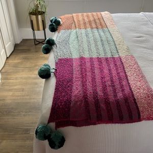 Anthropologie 60x70 acrylic throw. A couple of the poms are not as big as others
